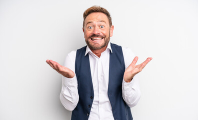 middle age handsome man feeling happy and astonished at something unbelievable