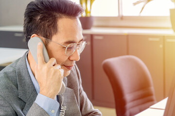 Businessmen provide customer information by telephone.Call centre support distance communication concept. 