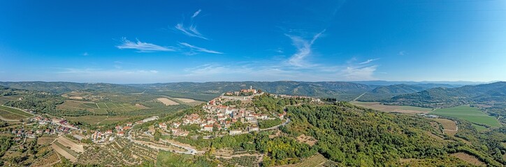 Fototapeta na wymiar Drone panorama on historical Croatian town Motovun in Istria during daytime with clear sky and sunshine