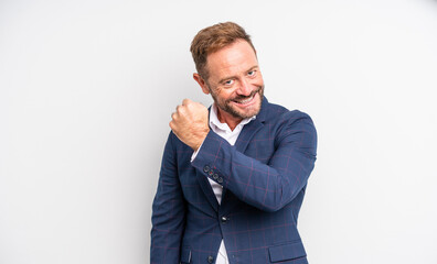 middle age handsome man feeling happy and facing a challenge or celebrating. businessman concept