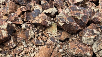 Chipped rubble stone. Crimson Quartzite.  Random pieces of red stones used in interior, exterior, landscape design.