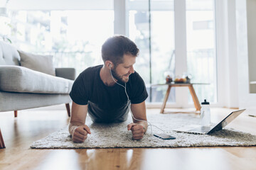 Handsome man working out at home