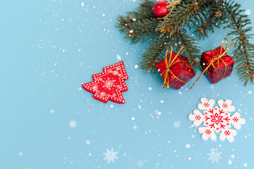 Christmas background, blue background with green spruce branch.