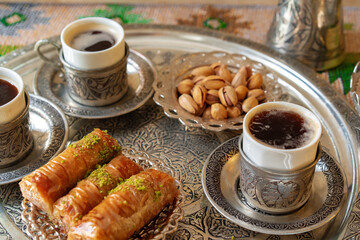 Traditional arabic dessert baklava with a cup of turkish coffee