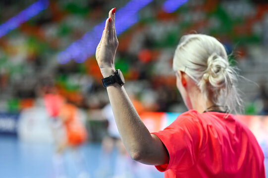 handball woman referee with raice hand as a sign of playing for time