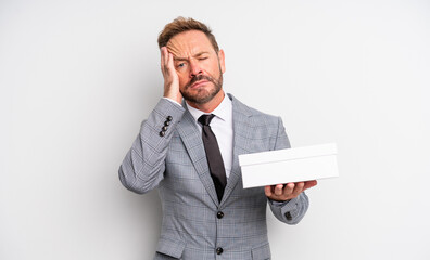 middle age handsome man feeling bored, frustrated and sleepy after a tiresome. white pack concept
