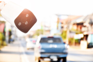 Closeup of traffic security camera surveillance (CCTV) on the road in the rural city of Thailand.