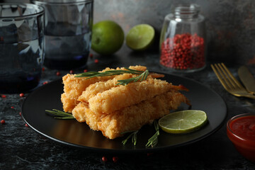 Сoncept of tasty food with deep-fried shrimp on dark table