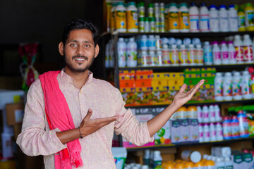Indian farmer standing at fertilizer shop