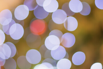 Golden and multicolored bokeh circle background for christmas and happy new year with space to display messages.