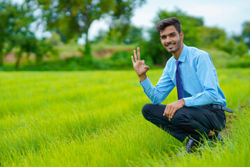 Indian agronomist at green onion agriculture field