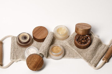Brown sugar, coffee and honey ingredients for scrub in glass jars with wooden lid on exfoliating body strap for homemade cosmetic. Beauty, Spa, skin care, aromatherapy concept