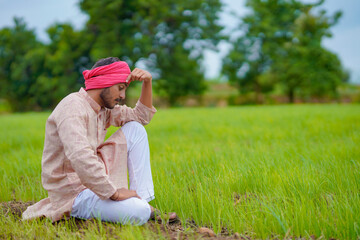 Young indian farmer in depression.