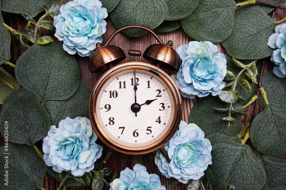 Canvas Prints Alarm clock with eucalyptus leaves and flower decorate on wooden background