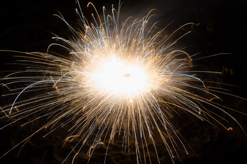 Long Exposure shot of Ground Spinner fireworks during the Diwali festival in India, Diwali festival background, People enjoying the diwali festival by burning firecrackers