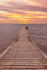 Wooden jetty at the Baltic Sea coast of Lolland, Denmark in sunset
