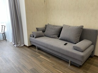 Grey sofa with pillows in living room