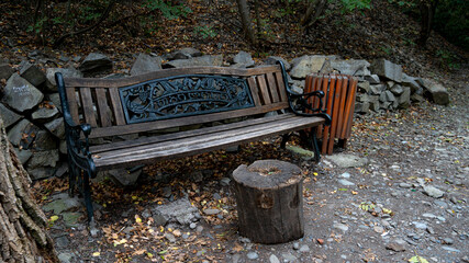 old shop in the woods. a true scary shop in a dark park. vintage wooden bench
