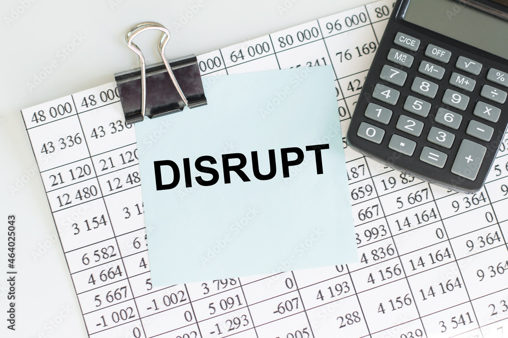 Aufkleber text disrupt on paper on the background of numbers and calculator on the table