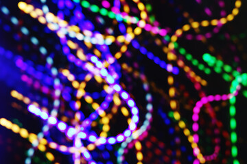 Festive background. Multicolored bokeh. Selective focus.