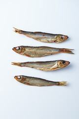 Smoked european sprats over white background