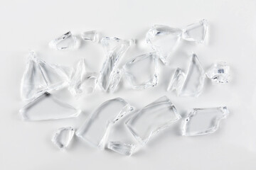 Shards of broken glass on white background