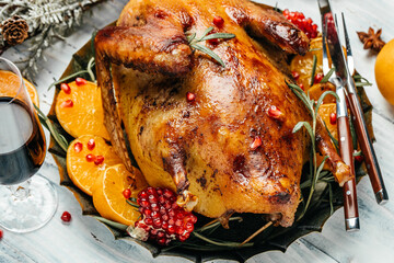 baked whole duck with orange, rosemary and berry. festive christmas recipe. Food recipe background. Close up