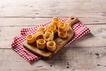 Traditional English Yorkshire pudding on wooden table.	