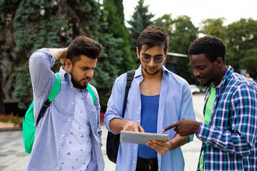 The group of indian students help your classmate with navigation