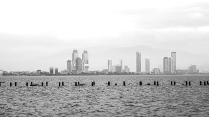 Obraz premium A landscape of Izmir with old pier, black and white photograph. 