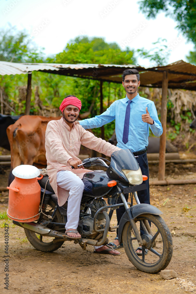 Sticker Indian farmer with agronomist at his cattle farm