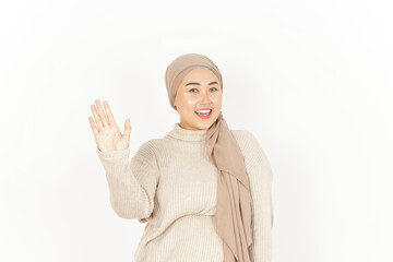 Waving Hand Greeting of Beautiful Asian Woman Wearing Hijab Isolated On White Background