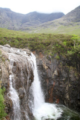 flowing waterfall of fairy falls on the isle of skye