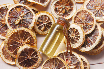 essential citrus oil, dried lemon and spice on table ,