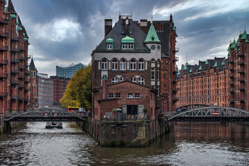 canal and historic buildings in old warehouse district Speicherstadt in Hamburg, Germany