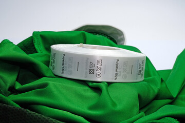 Skein tags for clothing, satin ribbon with symbols for the use of clothing. Green 100 % Polyester...