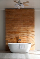 Naklejka na ściany i meble White bathtub with towel near wooden wall in room