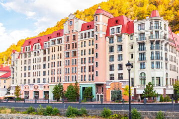 Colorful houses on the embankment in the Rosa Khutor resort.