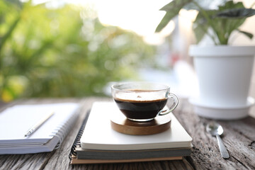 Coffee with crema and diary notebooks
