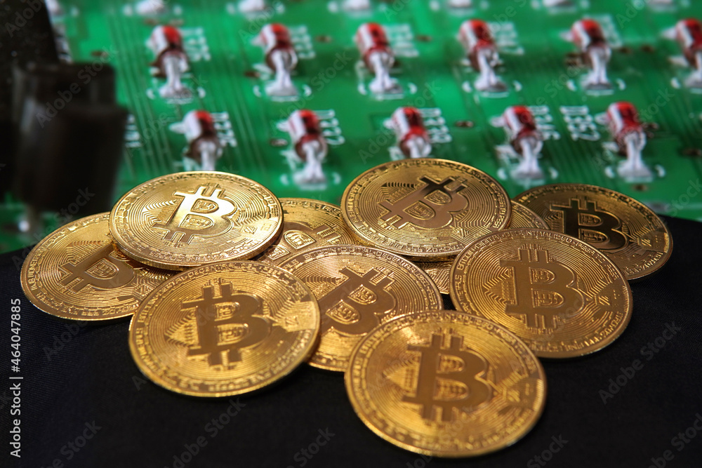 Sticker Closeup of bitcoins on a blurred microcircuit background