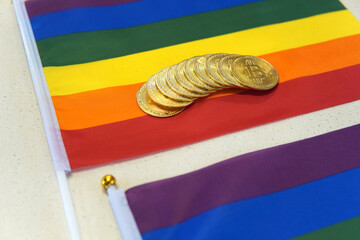 Closeup of bitcoins on an LGBT Pride flag