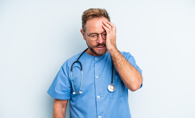 middle age handsome man feeling bored, frustrated and sleepy after a tiresome. nurse concept