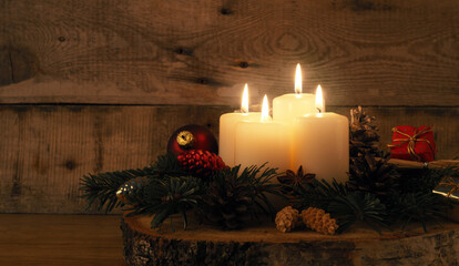 Fourth Advent candle burning, traditional Christmas decoration