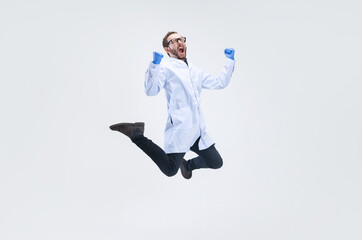 One excited man, chemist, doctor jumping high and joy isolated on white background.