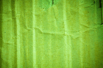 Green cardboard paper background vignette.