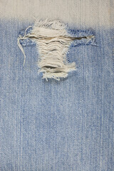 Torn denim Jeans texture. - obrazy, fototapety, plakaty