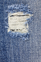 Denim torn blue jeans texture. - obrazy, fototapety, plakaty