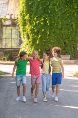 Girls and boys walking in park