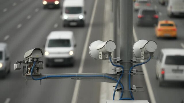 Road security camera for speed pacification installed on the expressway. Cloudy day