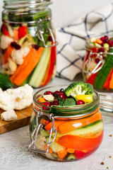 Fermented vegetables in glass jars. Fermented preserved vegetarian food. Homemade canned food concept. Various pickled vegetables.